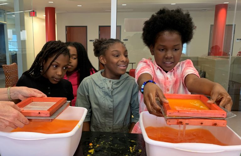 Elementary school children participating in an experiment.